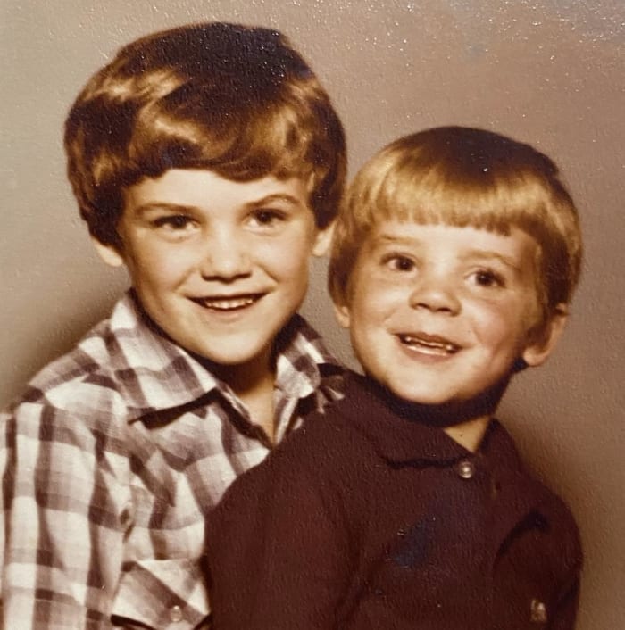 Dusty May, right, with his brother, David.